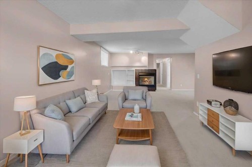 231 Tuscany Drive Nw, Calgary, AB - Indoor Photo Showing Living Room With Fireplace