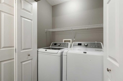 139 Hidden Creek Gardens Nw, Calgary, AB - Indoor Photo Showing Laundry Room