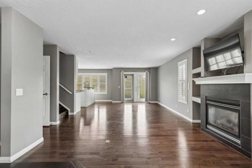 139 Hidden Creek Gardens Nw, Calgary, AB - Indoor Photo Showing Living Room With Fireplace