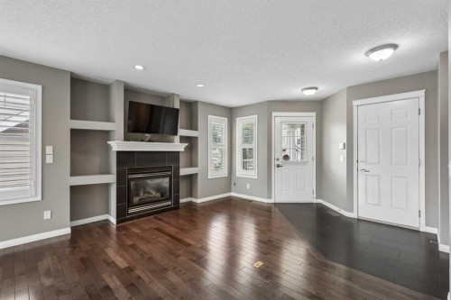 139 Hidden Creek Gardens Nw, Calgary, AB - Indoor Photo Showing Living Room With Fireplace