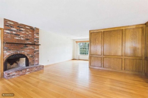 5 Chisholm Crescent Nw, Calgary, AB - Indoor Photo Showing Living Room With Fireplace