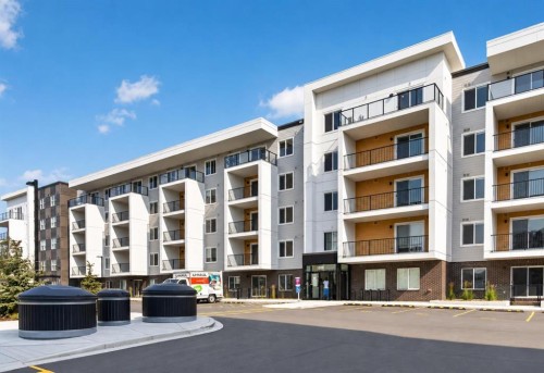 1522-265 Wolf Willow Boulevard Se, Calgary, AB - Outdoor With Balcony With Facade