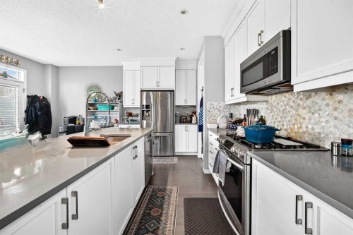 169 Windford Park Sw, Airdrie, AB - Indoor Photo Showing Kitchen With Upgraded Kitchen