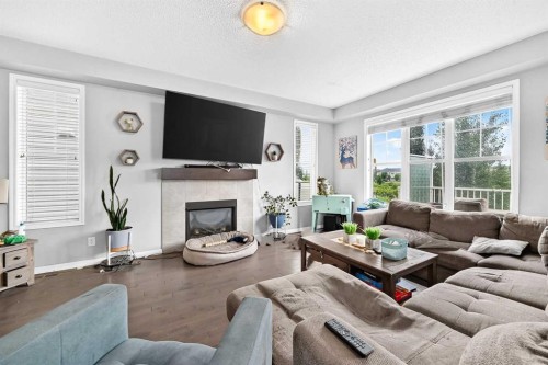 169 Windford Park Sw, Airdrie, AB - Indoor Photo Showing Living Room With Fireplace