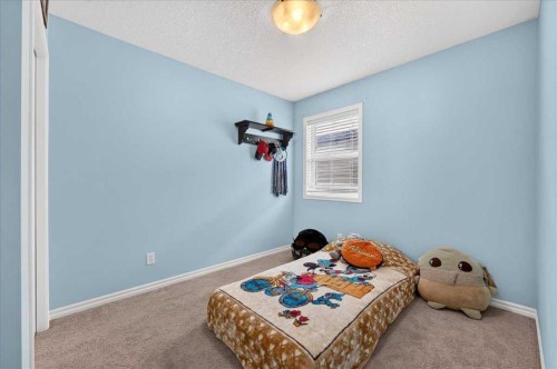 128 Cranberry Circle Se, Calgary, AB - Indoor Photo Showing Bedroom