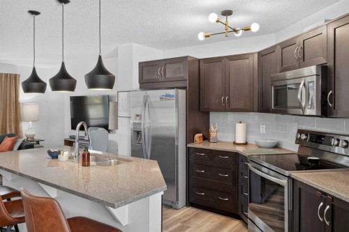 19 Marine Drive Se, Calgary, AB - Indoor Photo Showing Kitchen With Stainless Steel Kitchen With Double Sink With Upgraded Kitchen