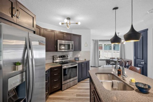 19 Marine Drive Se, Calgary, AB - Indoor Photo Showing Kitchen With Stainless Steel Kitchen With Double Sink With Upgraded Kitchen