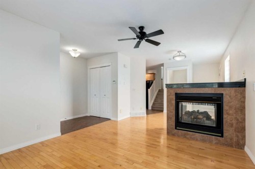 2234 15A Street Se, Calgary, AB - Indoor Photo Showing Living Room With Fireplace