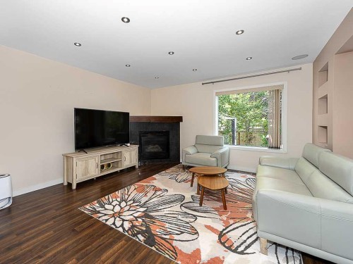 3782 Douglas Ridge Link Se, Calgary, AB - Indoor Photo Showing Living Room With Fireplace