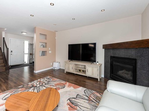 3782 Douglas Ridge Link Se, Calgary, AB - Indoor Photo Showing Living Room With Fireplace