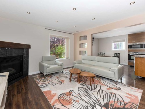 3782 Douglas Ridge Link Se, Calgary, AB - Indoor Photo Showing Living Room With Fireplace