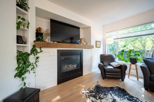 98 Chapala Grove Se, Calgary, AB - Indoor Photo Showing Living Room With Fireplace