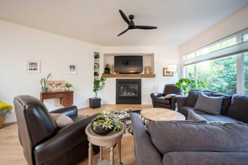 98 Chapala Grove Se, Calgary, AB - Indoor Photo Showing Living Room With Fireplace