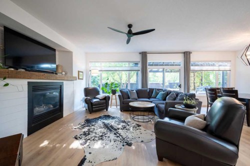 98 Chapala Grove Se, Calgary, AB - Indoor Photo Showing Living Room With Fireplace