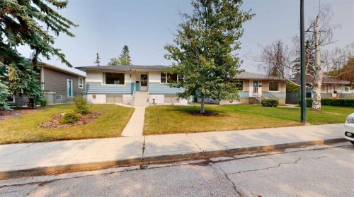 712 55 Avenue Sw, Calgary, AB - Outdoor With Facade