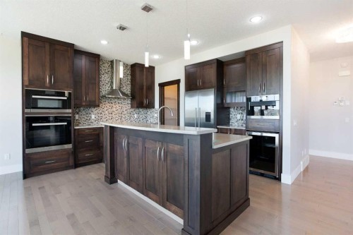 49 Cimarron Springs Circle, Okotoks, AB - Indoor Photo Showing Kitchen With Upgraded Kitchen