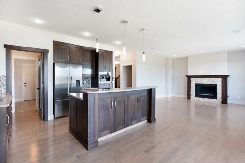 49 Cimarron Springs Circle, Okotoks, AB - Indoor Photo Showing Other Room With Fireplace