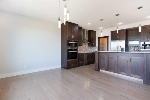 49 Cimarron Springs Circle, Okotoks, AB - Indoor Photo Showing Kitchen With Upgraded Kitchen