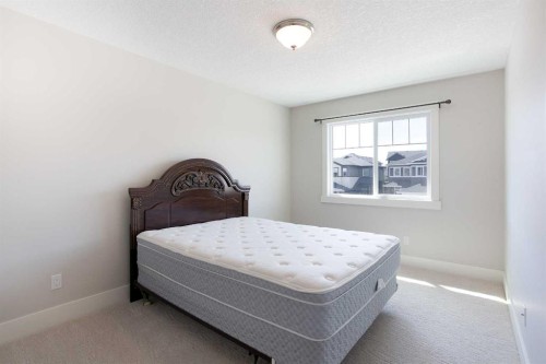 49 Cimarron Springs Circle, Okotoks, AB - Indoor Photo Showing Bedroom