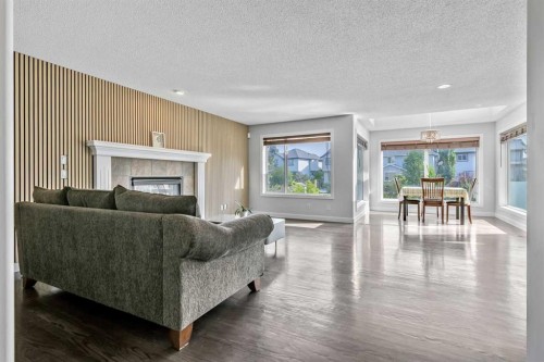 123 Cranwell Close Se, Calgary, AB - Indoor Photo Showing Living Room With Fireplace