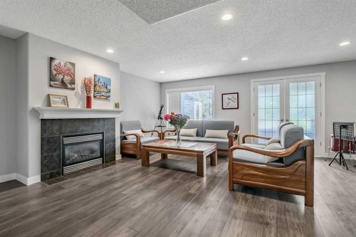 123 Cranwell Close Se, Calgary, AB - Indoor Photo Showing Living Room With Fireplace