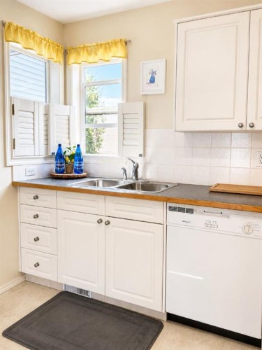 122 Bridlewood Lane Sw, Calgary, AB - Indoor Photo Showing Kitchen With Double Sink
