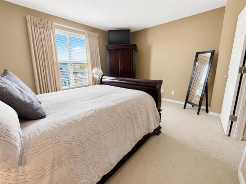 122 Bridlewood Lane Sw, Calgary, AB - Indoor Photo Showing Bedroom