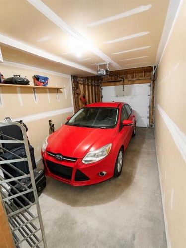 122 Bridlewood Lane Sw, Calgary, AB - Indoor Photo Showing Garage