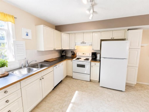 122 Bridlewood Lane Sw, Calgary, AB - Indoor Photo Showing Kitchen With Double Sink