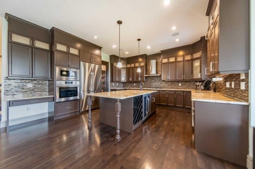 1109 Coopers Drive Sw, Airdrie, AB - Indoor Photo Showing Kitchen With Upgraded Kitchen