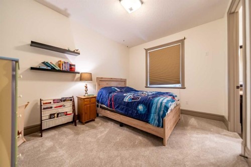 1109 Coopers Drive Sw, Airdrie, AB - Indoor Photo Showing Bedroom