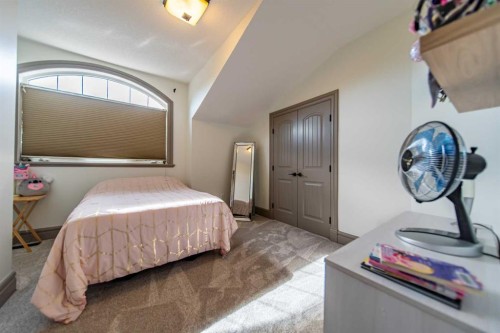 1109 Coopers Drive Sw, Airdrie, AB - Indoor Photo Showing Bedroom