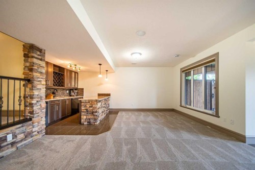 1109 Coopers Drive Sw, Airdrie, AB - Indoor With Fireplace