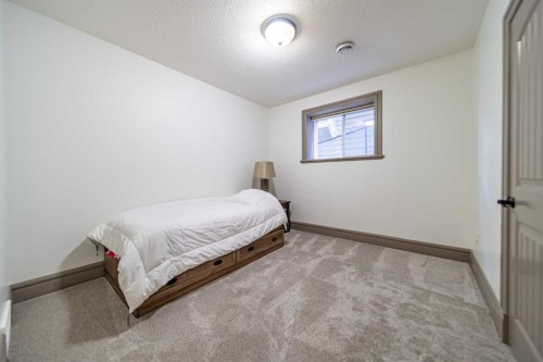 1109 Coopers Drive Sw, Airdrie, AB - Indoor Photo Showing Bedroom