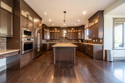 1109 Coopers Drive Sw, Airdrie, AB - Indoor Photo Showing Kitchen With Upgraded Kitchen