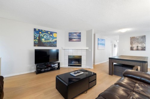76 Douglas Ridge Close Se, Calgary, AB - Indoor Photo Showing Living Room With Fireplace
