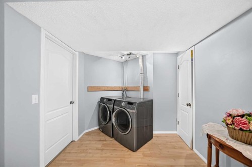 65 Tuscarora Place Nw, Calgary, AB - Indoor Photo Showing Laundry Room