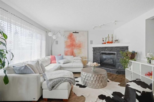 173 Tuscany Ridge View Nw, Calgary, AB - Indoor Photo Showing Living Room With Fireplace