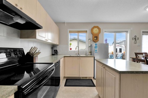 238 Covepark Way Ne, Calgary, AB - Indoor Photo Showing Kitchen With Double Sink