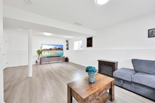 38 Balsam Crescent, Olds, AB - Indoor Photo Showing Living Room With Fireplace