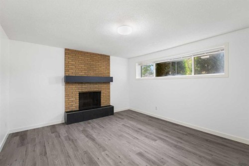 6008 Dalgetty Drive Nw, Calgary, AB - Indoor Photo Showing Other Room With Fireplace