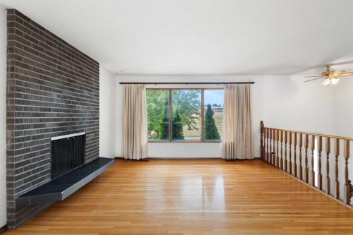 6008 Dalgetty Drive Nw, Calgary, AB - Indoor With Fireplace