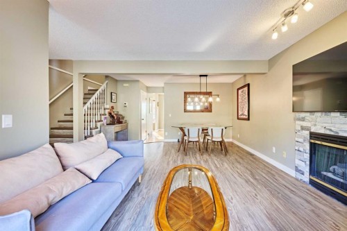 193 Patina Park Sw, Calgary, AB - Indoor Photo Showing Living Room With Fireplace