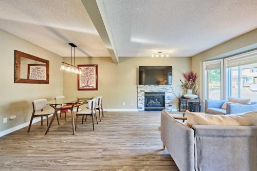 193 Patina Park Sw, Calgary, AB - Indoor Photo Showing Living Room With Fireplace