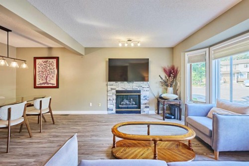 193 Patina Park Sw, Calgary, AB - Indoor Photo Showing Living Room With Fireplace