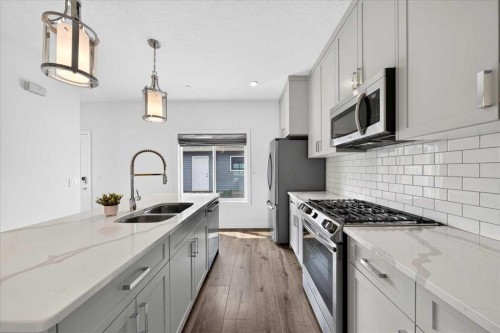 14945 1 Street Nw, Calgary, AB - Indoor Photo Showing Kitchen With Double Sink With Upgraded Kitchen