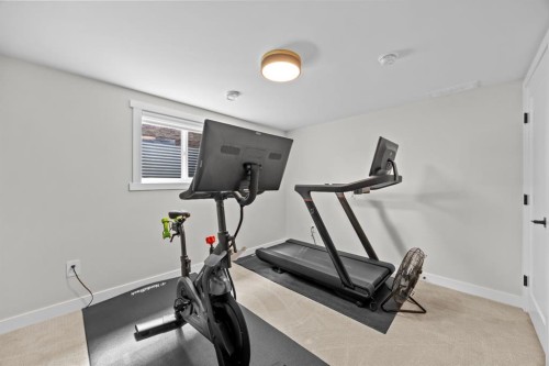 67 Hollyburn Road Sw, Calgary, AB - Indoor Photo Showing Gym Room
