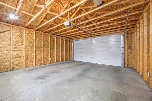 67 Hollyburn Road Sw, Calgary, AB - Indoor Photo Showing Garage