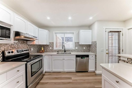 170 Country Hills Heights, Calgary, AB - Indoor Photo Showing Kitchen With Upgraded Kitchen