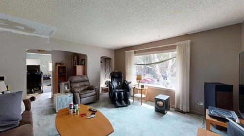 708 55 Avenue Sw, Calgary, AB - Indoor Photo Showing Living Room
